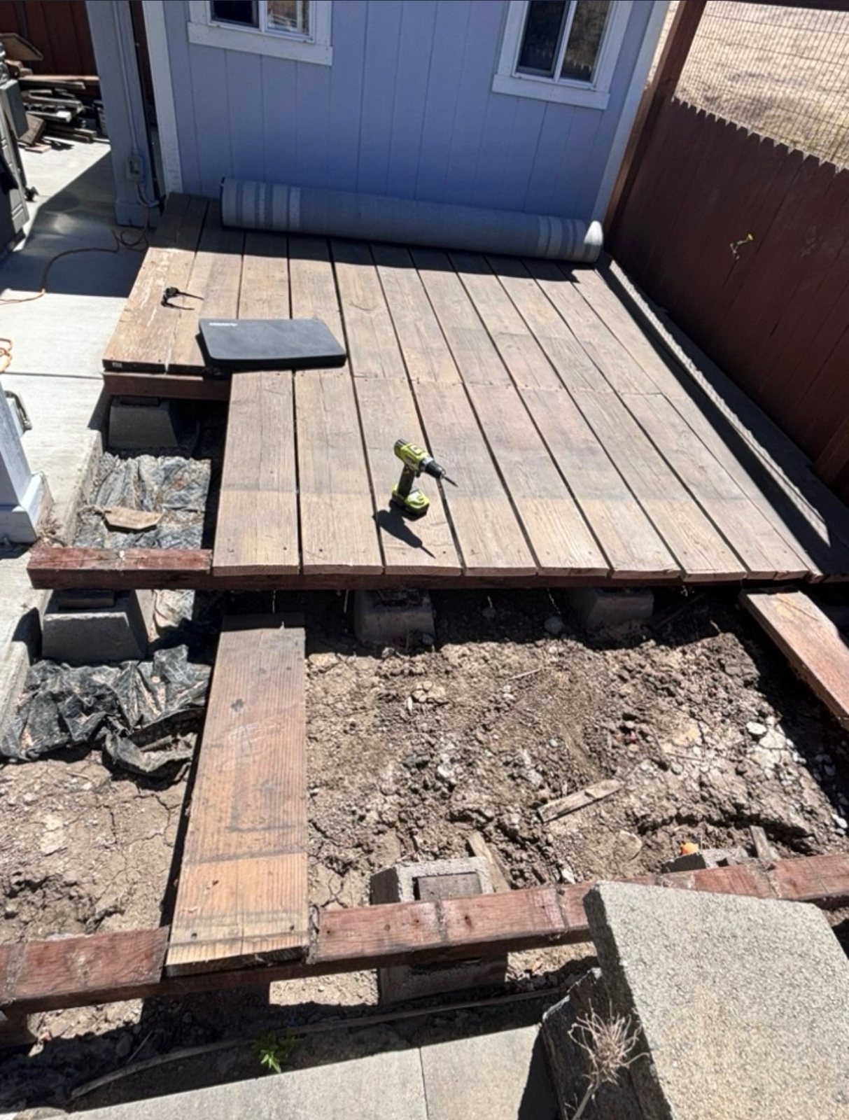 Services Old backyard deck being torn out for construction debris removal in Elk Grove, CA